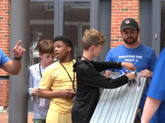 Campers setting up race cars
