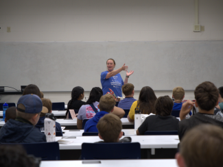 Camp organizer talking to campers