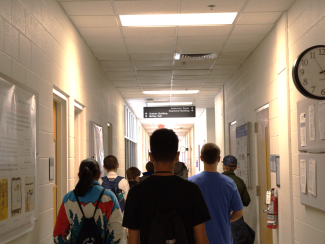 Campers walking in a hallway