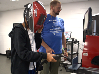 Camper working on virtual welding