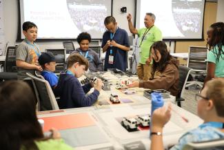 Campers assemble model cars