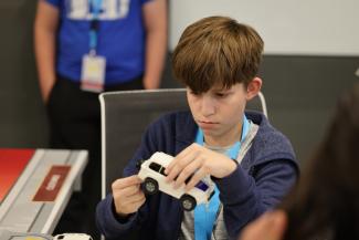 Camper assembles model car