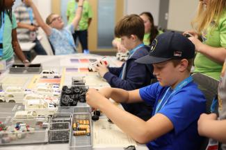Campers assemble model car