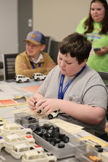 Campers assemble model car