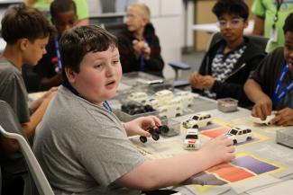 Campers assemble model car