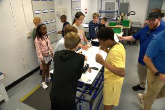 Campers building cylinder
